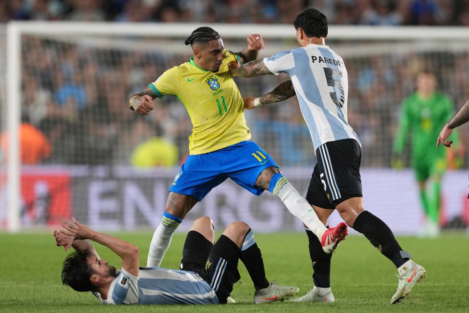 Soccer players from Argentina and Brazil competing during a match.
