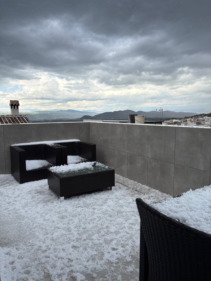 Hailstones covering patio furniture.