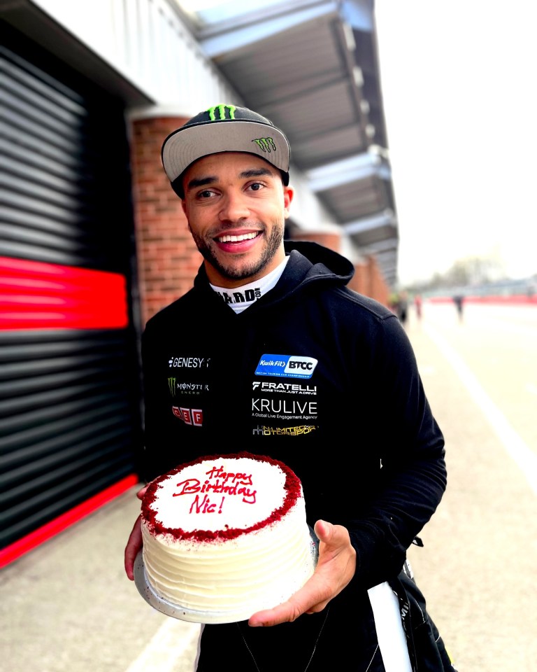 Man holding a birthday cake.