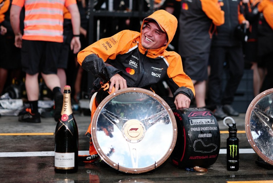 Formula One F1 - Australian Grand Prix - Albert Park Grand Prix Circuit, Melbourne, Australia - March 16, 2025 McLaren's Lando Norris celebrates with the trophy after winning the Australian Grand Prix REUTERS/Mark Peterson
