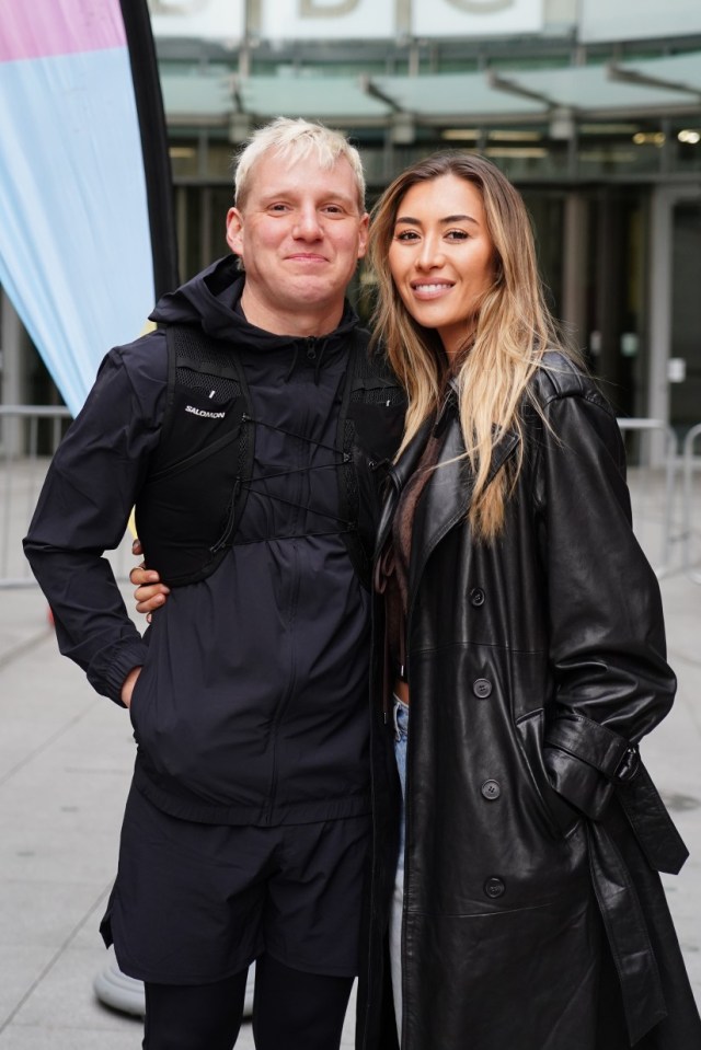 Radio 1 presenter Jamie Laing poses for a photo with his wife Sophie Habboo, outside BBC Broadcasting House in London before his Red Nose Day Run, a 150+ mile run from London to Manchester to raise money for Comic Relief. Picture date: Monday March 17, 2025. PA Photo. See PA story SHOWBIZ ComicRelief. Photo credit should read: Ian West/PA Wire