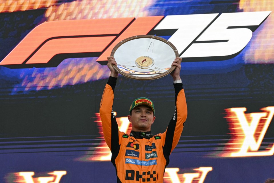 First-placed McLaren's British driver Lando Norris celebrates on the podium after the Australian Formula One Grand Prix at Albert Park Circuit in Melbourne on March 16, 2025. (Photo by Saeed KHAN / AFP) / -- IMAGE RESTRICTED TO EDITORIAL USE - STRICTLY NO COMMERCIAL USE -- (Photo by SAEED KHAN/AFP via Getty Images)