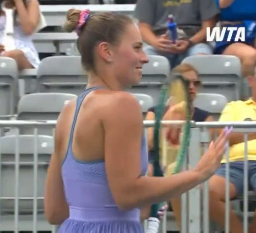 Tennis player in purple dress.