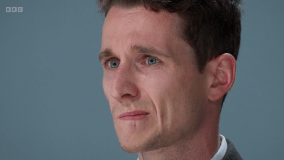 Close-up of a man appearing sad.