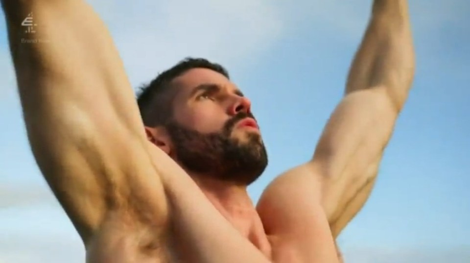 Muscular man with arms raised.