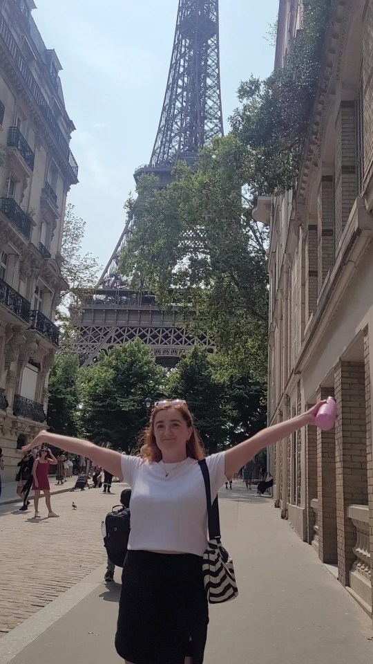 Woman in Paris with Eiffel Tower in background.