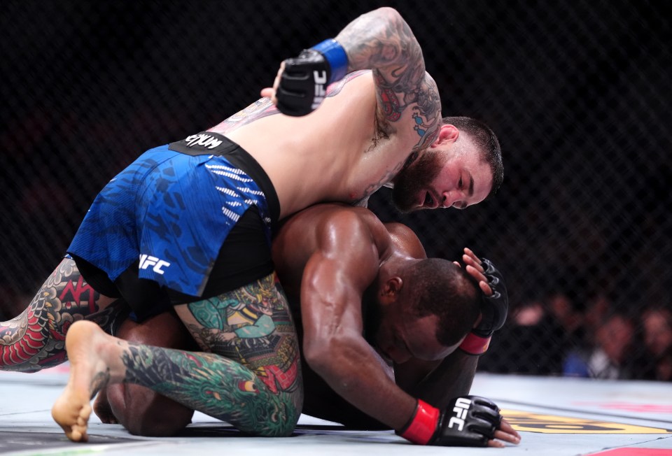 Sean Brady on top of Leon Edwards during a UFC welterweight bout.