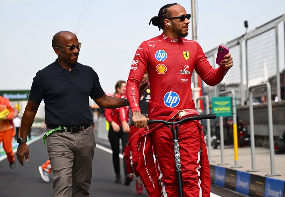 Lewis Hamilton and Anthony Hamilton at a racetrack.