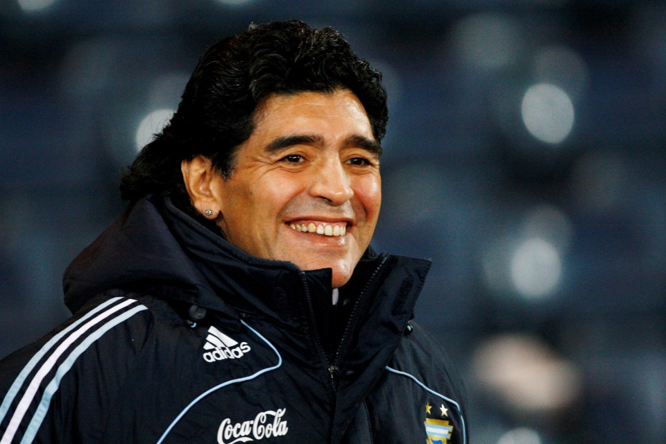 Diego Maradona, head coach of Argentina's soccer team, smiling.