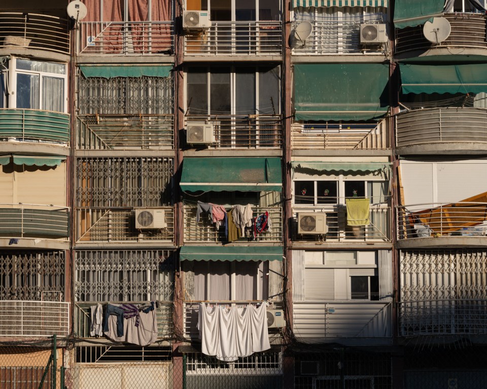 Benidorm apartment building with laundry hanging from balconies.