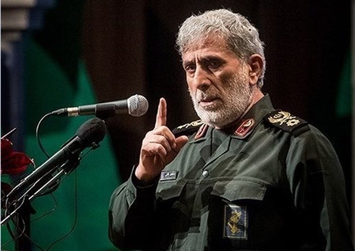 Brigadier General Ismail Qaani speaking at a podium.