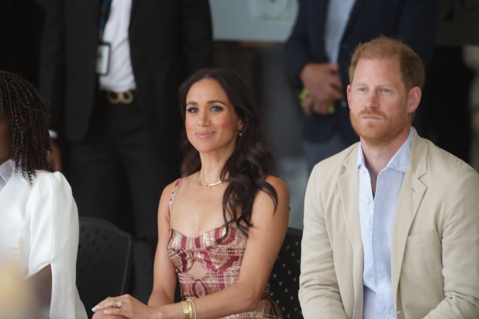 Prince Harry and Meghan Markle sitting together.