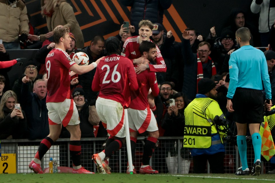 Manchester United players celebrating a goal.