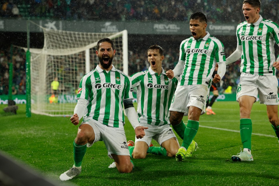 Real Betis players celebrating a goal.