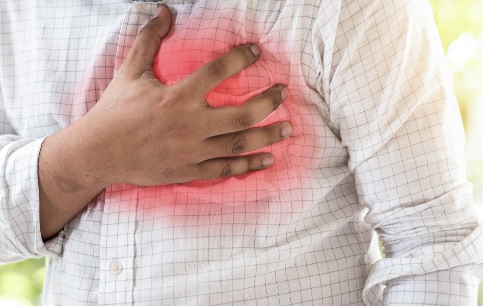 Man clutching his chest in pain.