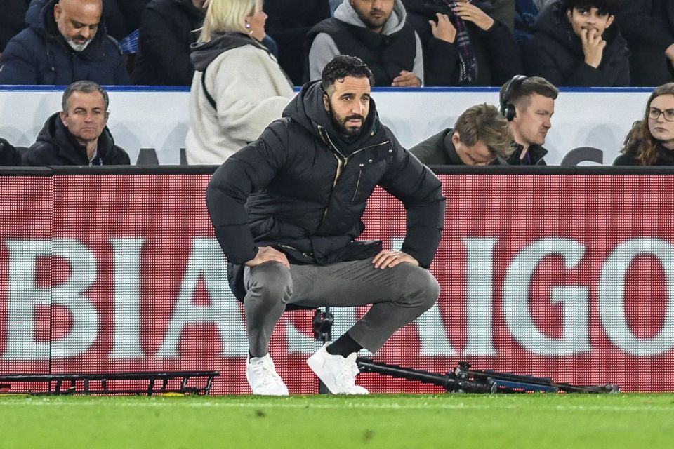 Soccer coach Ruben Amorim sits on the sidelines.
