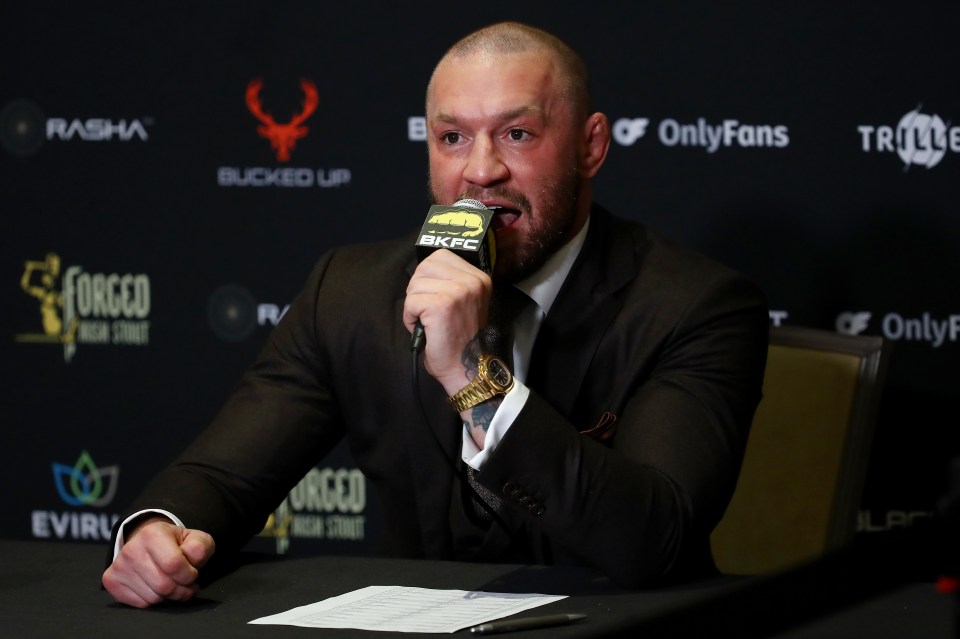 Conor McGregor speaking into a microphone.