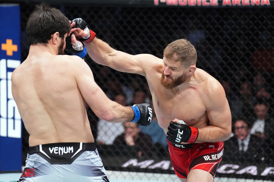 LAS VEGAS, NEVADA - DECEMBER 10: (R-L) Jan Blachowicz of Poland punches Magomed Ankalaev of Russia in their UFC light heavyweight championship fight during the UFC 282 event at T-Mobile Arena on December 10, 2022 in Las Vegas, Nevada. (Photo by Chris Unger/Zuffa LLC)