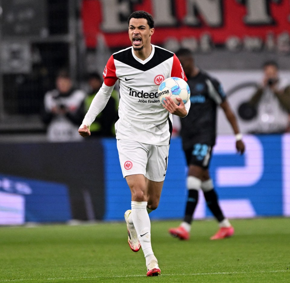 Hugo Ekitike celebrating a goal during a Bundesliga soccer match.