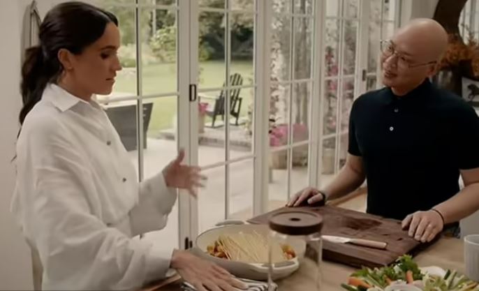 Meghan Markle and Daniel Martin in a cooking scene.