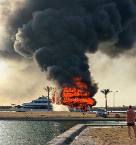 Burning boat in Port Ghalib, Egypt.