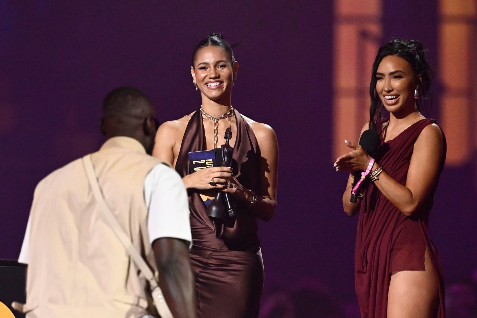 Vick Hope and Bre Tiesi presenting Stormzy with an award at the BRIT Awards.