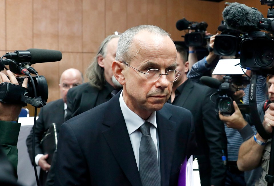 Guenter Lubitz leaving a press conference.