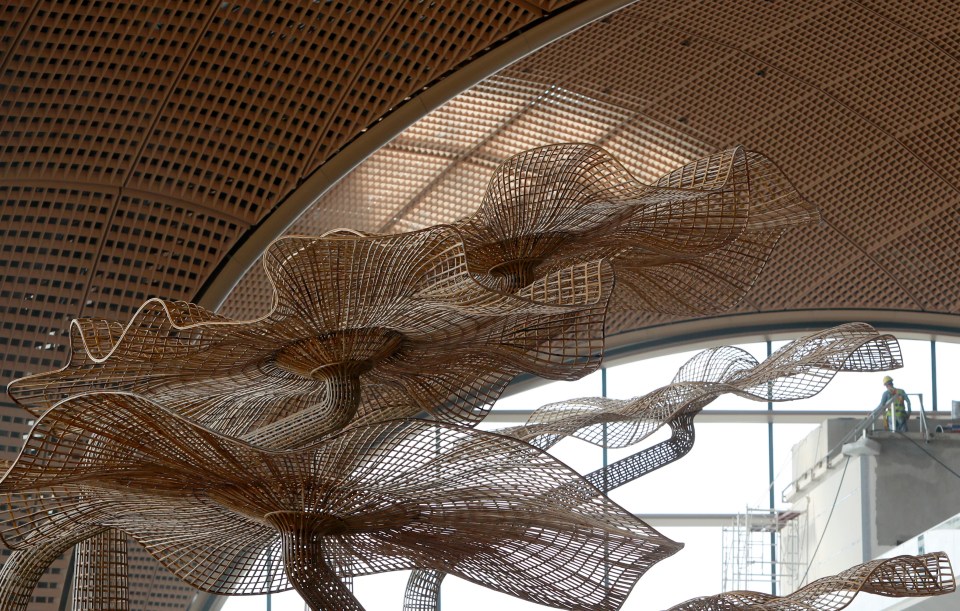 Woven bamboo sculpture in airport under construction.