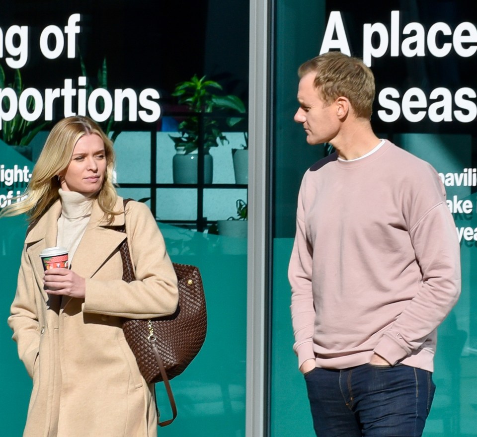 Nadiya Bychkova and Dan Walker leaving a building together.