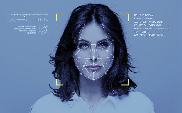 Facial recognition system analyzing a woman's face.