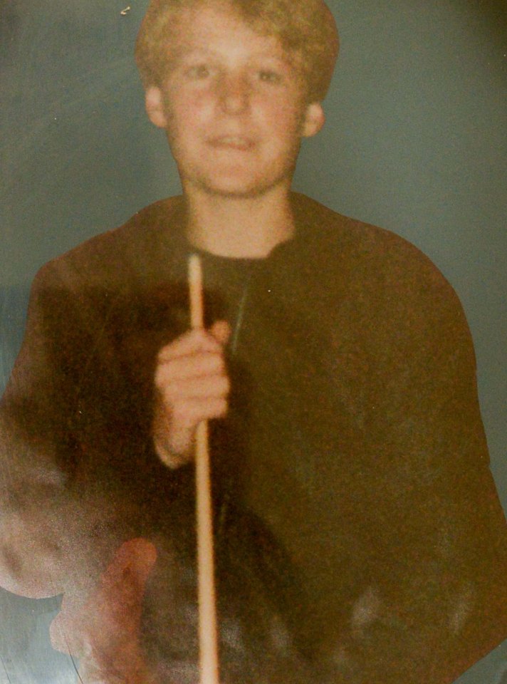 Photo of Ian Hambridge, aged 15, holding a pool cue.