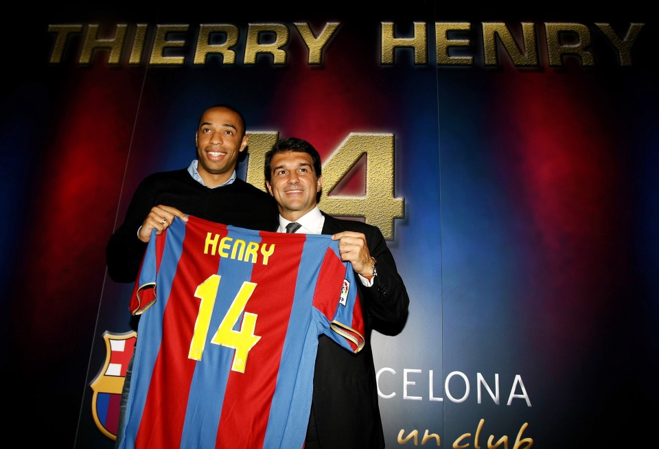 Thierry Henry holding his new Barcelona jersey with the club president.