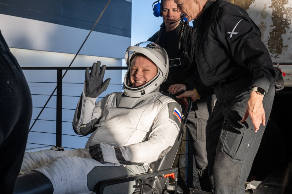 Astronaut Aleksandr Gorbunov waving after landing.