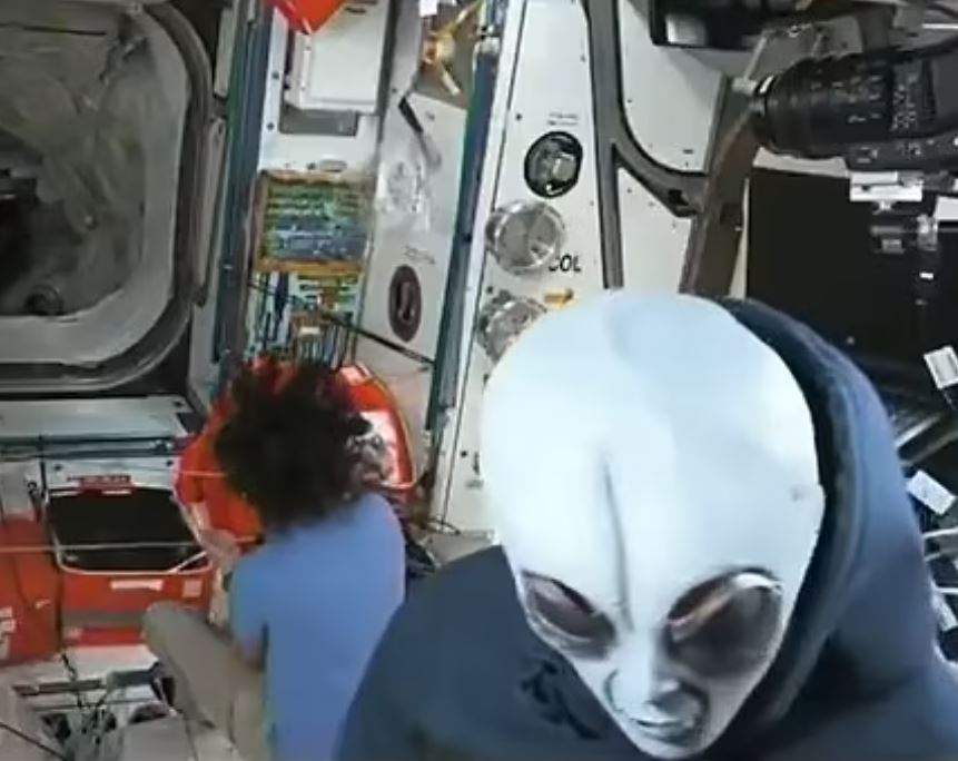 Astronauts greeting each other aboard the International Space Station.