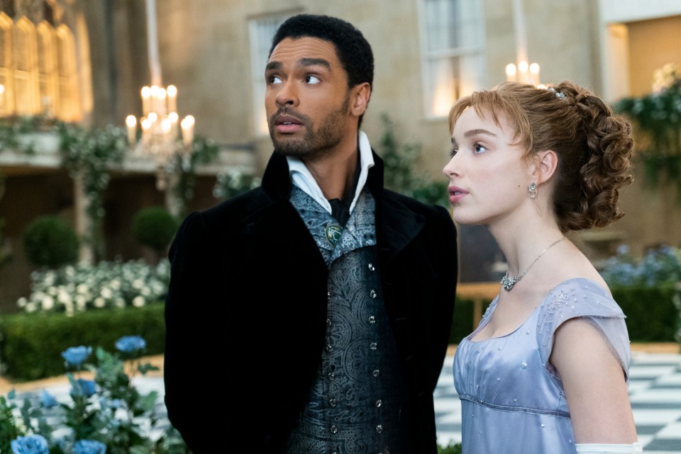 Phoebe Dynevor and Rege-Jean Page in a scene from *Bridgerton*.