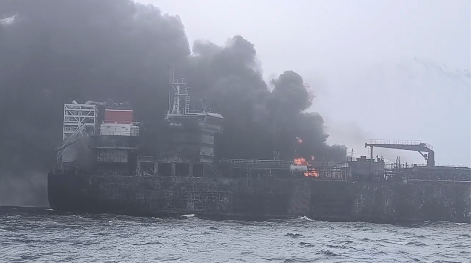 Burning cargo ship and tanker in the North Sea.