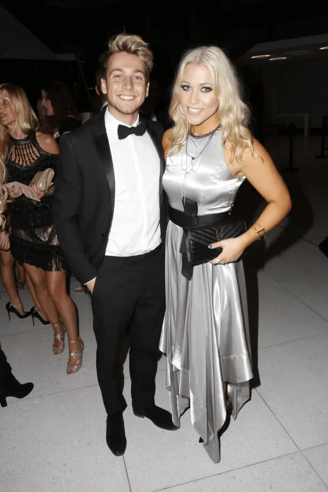 Couple in formal wear at an event.