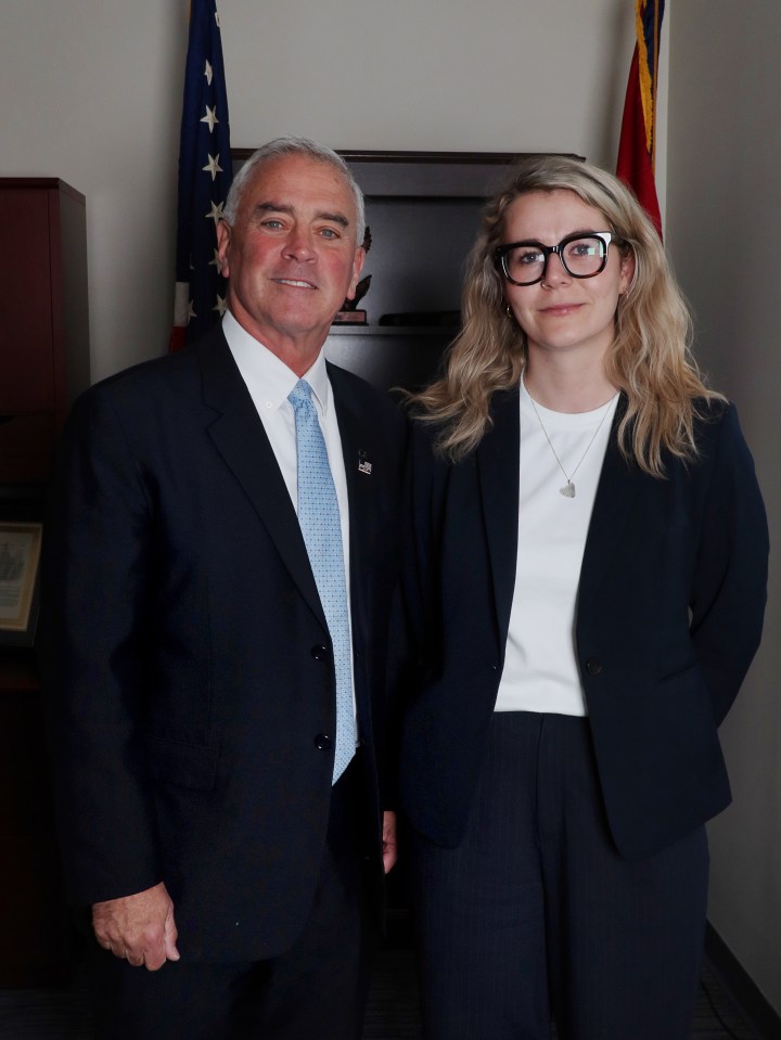 Portrait of a man and a woman in business attire.