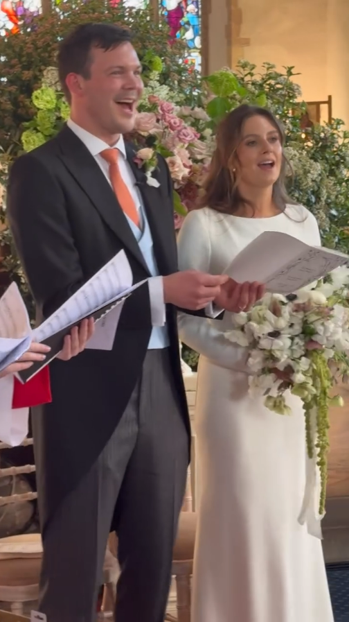 Bride and groom reading vows at their wedding.