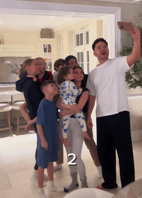 A large family taking a selfie.