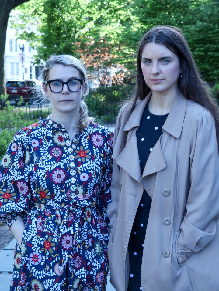 Two women standing outdoors.
