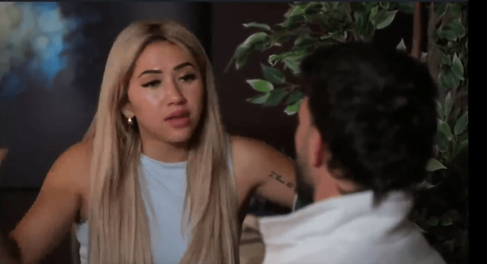 Woman with long blonde hair arguing with a man.