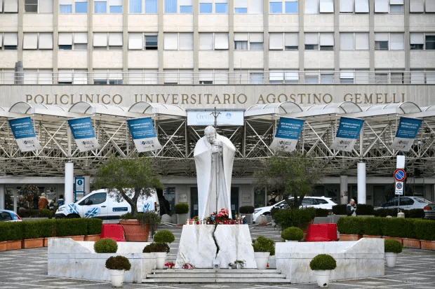 Statue of Pope John Paul II in front of Policlinico Universitario Agostino Gemelli hospital.