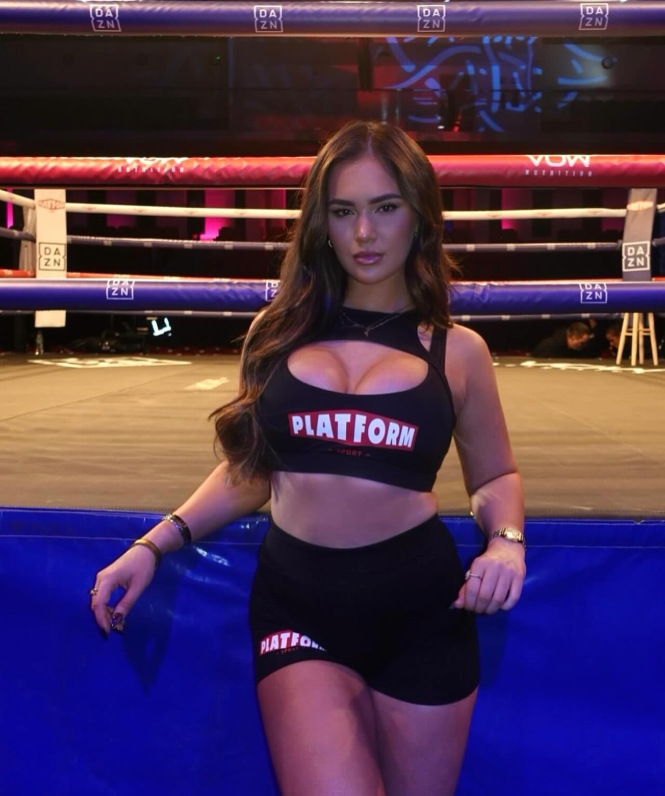 Woman in Platform Sport attire at a boxing match.