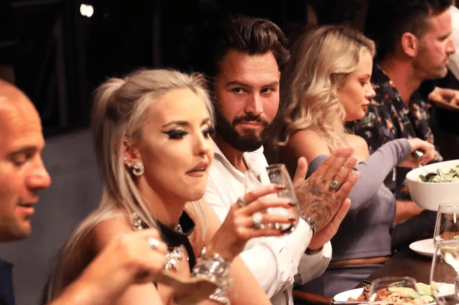 Group of people at a dinner table.