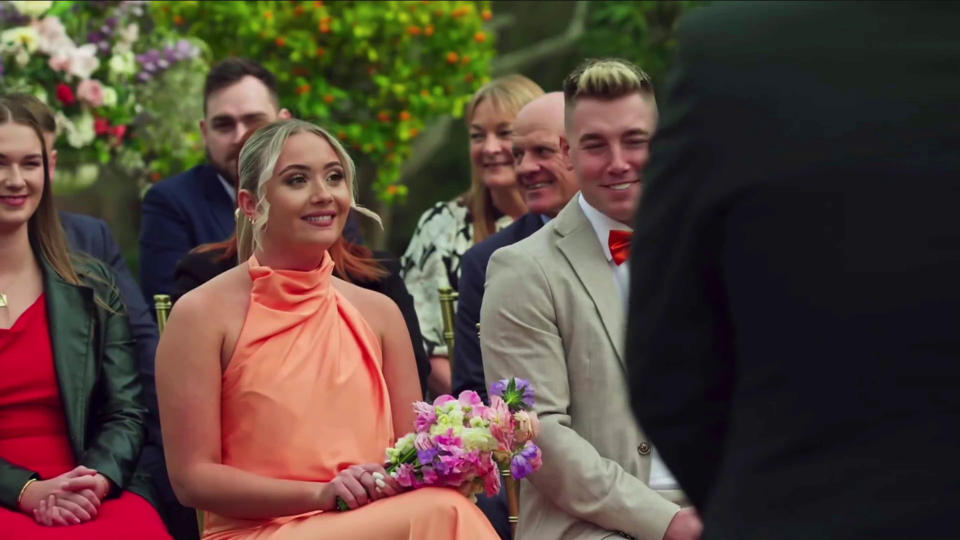 Groom mistaking bridesmaid for bride at wedding.
