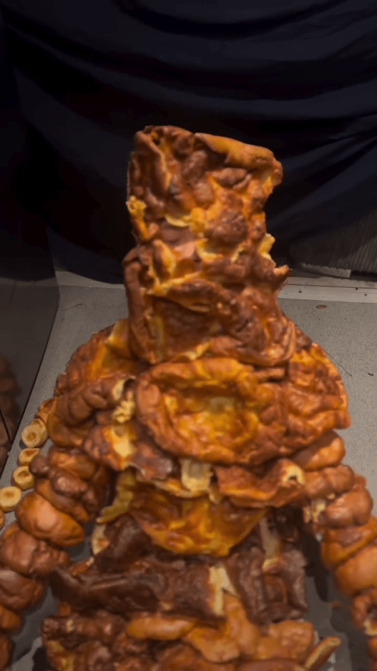 Person covered in Yorkshire puddings.