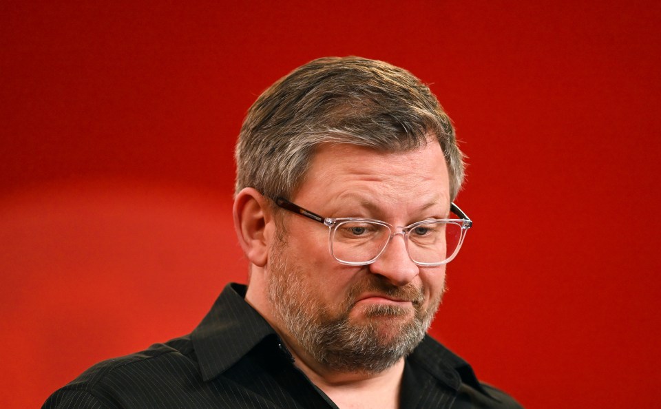 James Wade reacting during a sports event.