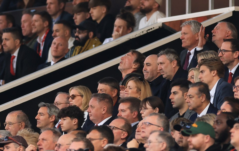 Jim Ratcliffe, minority shareholder of Manchester United, and others in the stands at a soccer match.
