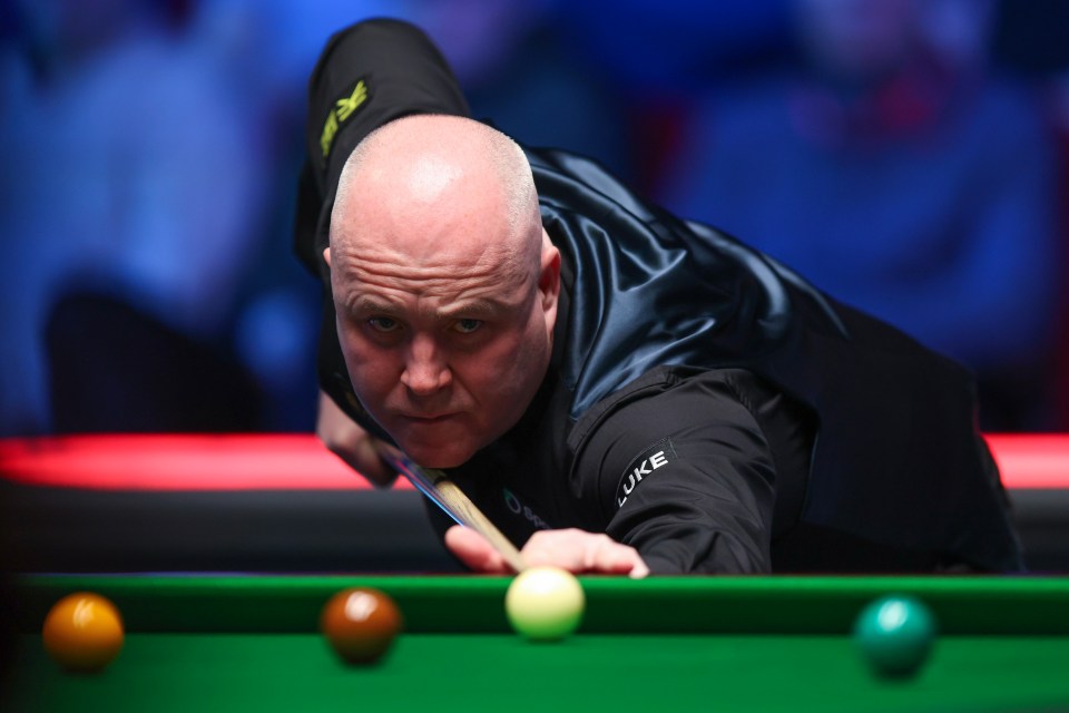 John Higgins of Scotland playing snooker.